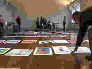 Members of the St. Louis Symphony Volunteer Association arrange entries in the 2019 Picture the Music contest.