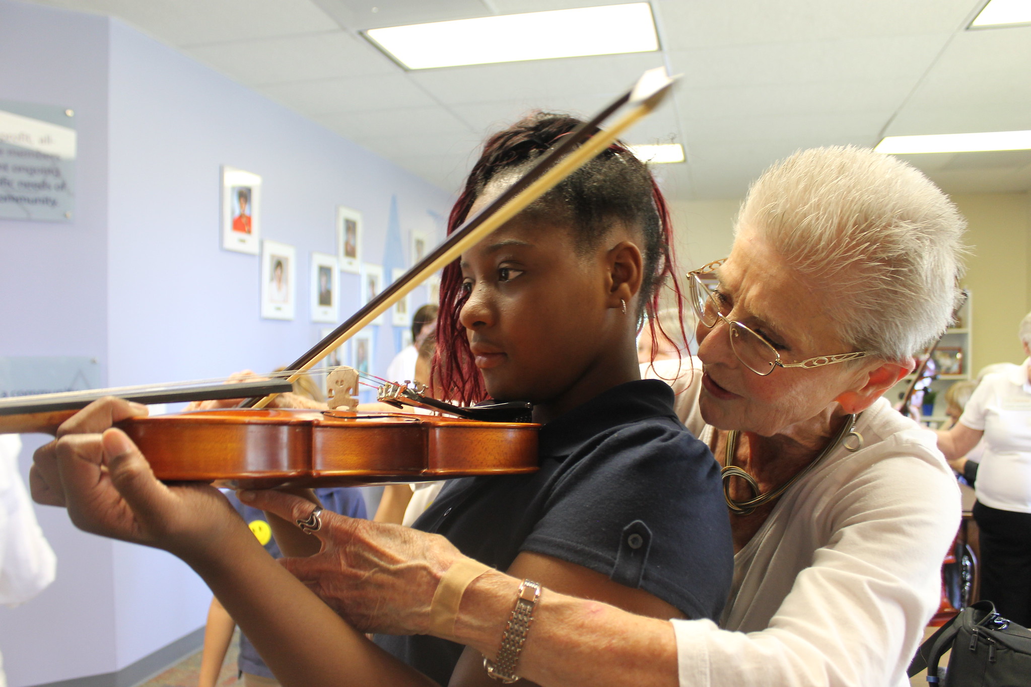 Linda Assisting Child with Instrument Playground